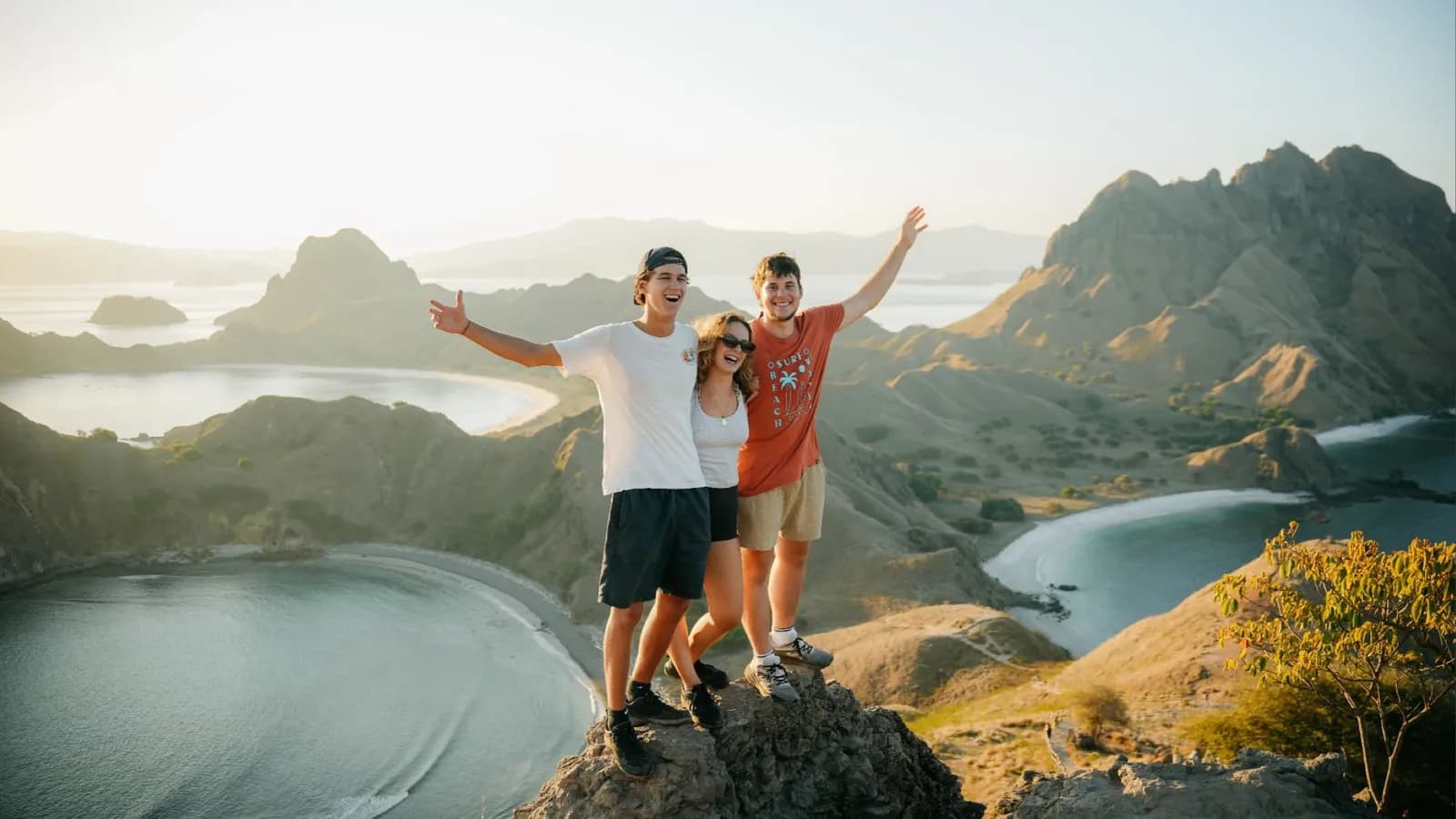 Guests watching sunset from Padar Island viewpoint