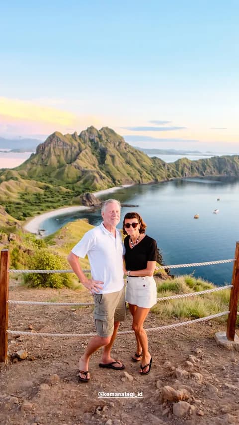 Couple enjoying the Padar Island viewpoint at sunset