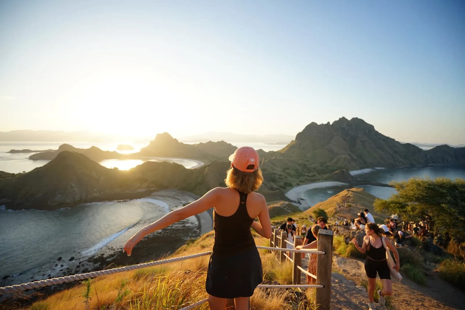 Guests watching sunset from Padar Island viewpoint